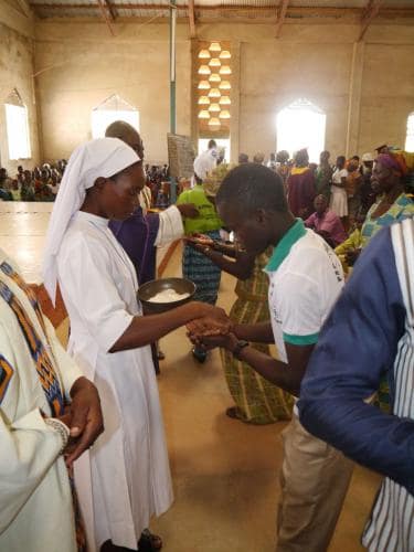 Administering Holy Communion - Rev. sister