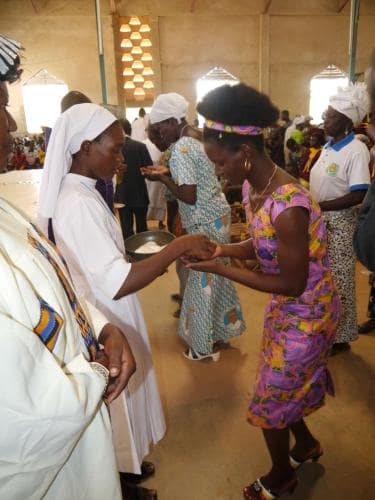 Administering Holy Communion - Rev. sister