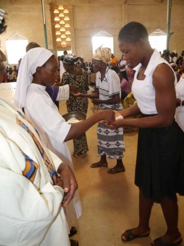 Administering Holy Communion - Rev. sister