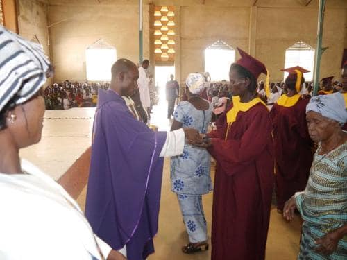 Administering Holy communion - Fr. John of God