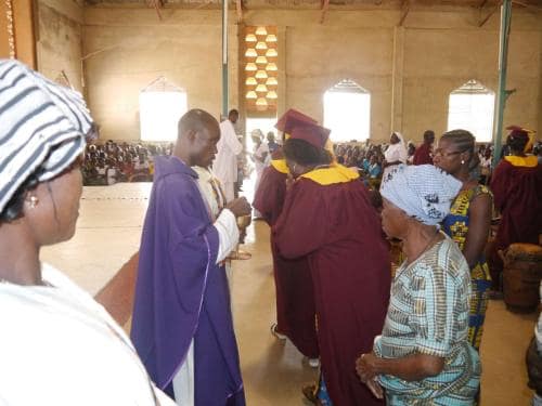 Administering Holy communion - Fr. John of God